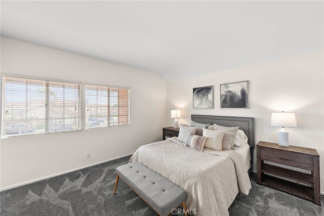 bedroom with baseboards, carpet, and vaulted ceiling