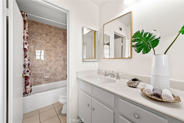 full bath featuring tile patterned floors, visible vents, toilet, shower / tub combo, and vanity