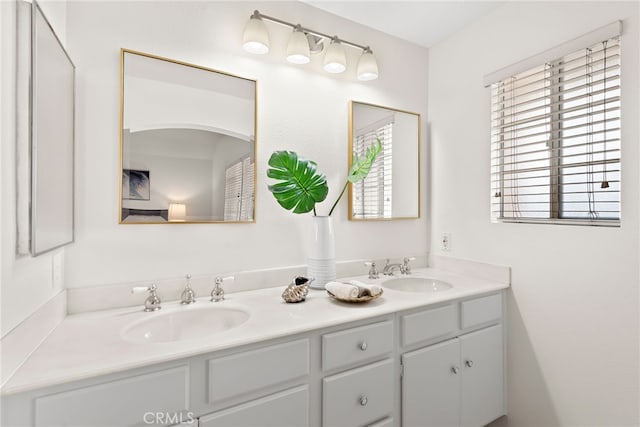 bathroom with double vanity and a sink