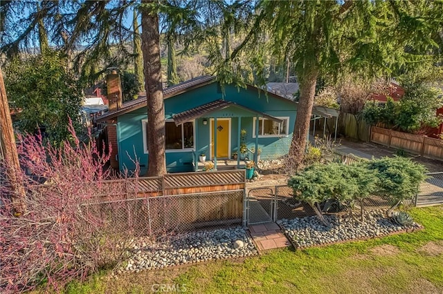 view of front of property with a gate and a fenced front yard