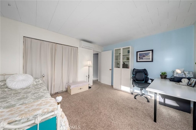 carpeted bedroom with a wall mounted AC