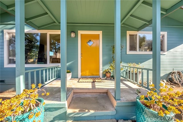 property entrance with covered porch