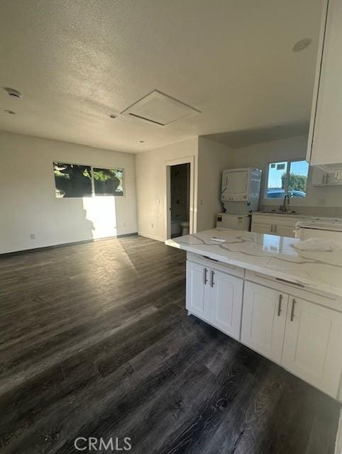 bathroom featuring vanity, wood finished floors, baseboards, and a textured ceiling