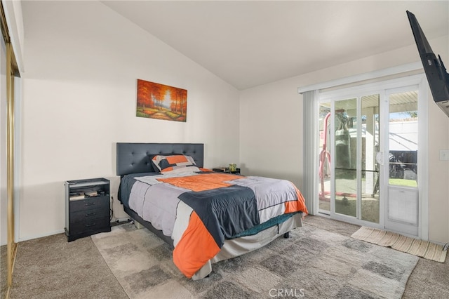 carpeted bedroom featuring access to exterior and lofted ceiling