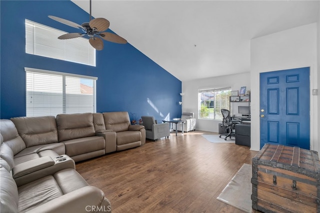 living room with ceiling fan, high vaulted ceiling, and wood finished floors