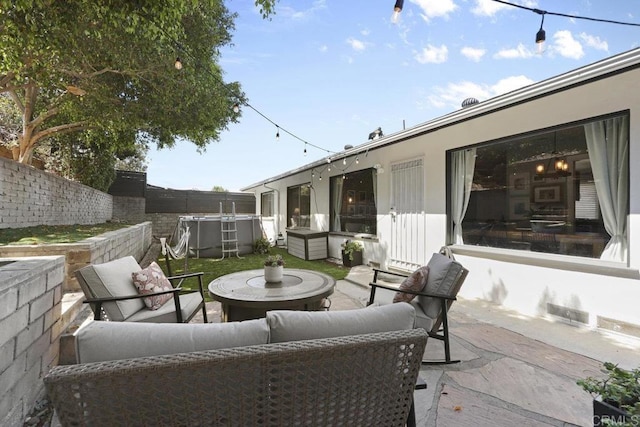 view of patio / terrace with outdoor lounge area and a fenced backyard