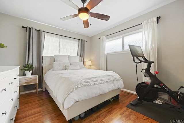 bedroom featuring a ceiling fan and wood finished floors