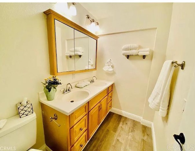 12153 Wintergreen Dr Unit 2, Lakeside, CA 92040 - bathroom with a sink, double vanity, toilet, and wood finished floors