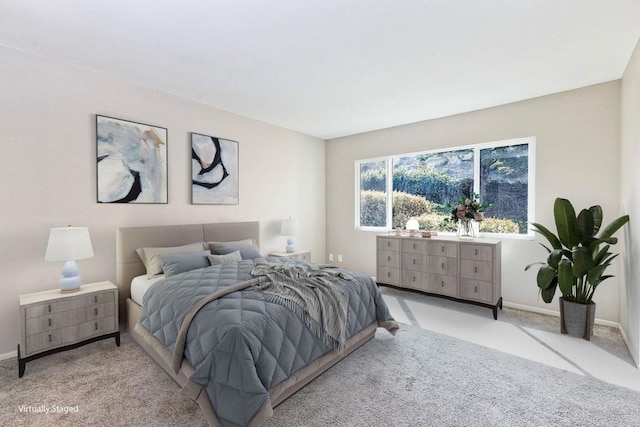 carpeted bedroom with baseboards