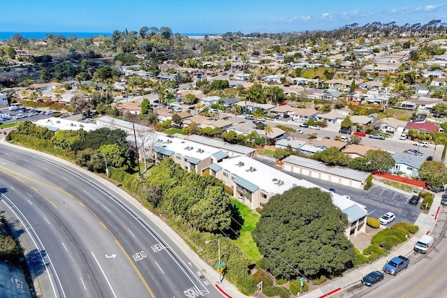 birds eye view of property with a residential view