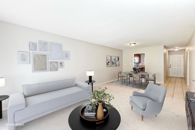 living room with light tile patterned floors and baseboards