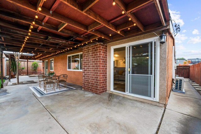 view of patio / terrace with outdoor dining space and fence