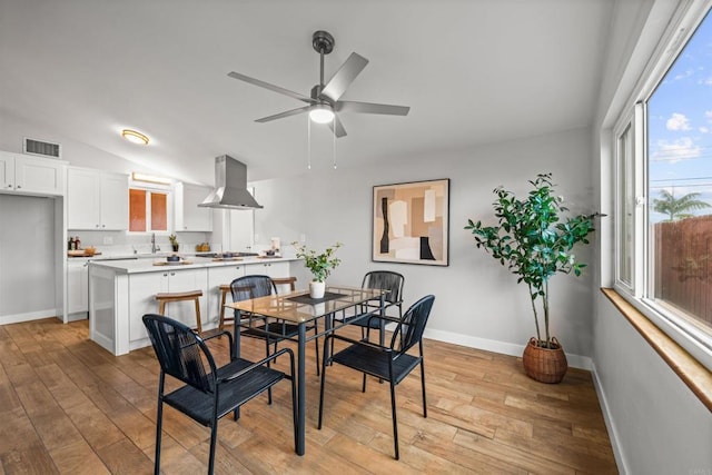 dining room with visible vents, plenty of natural light, and light wood-style flooring