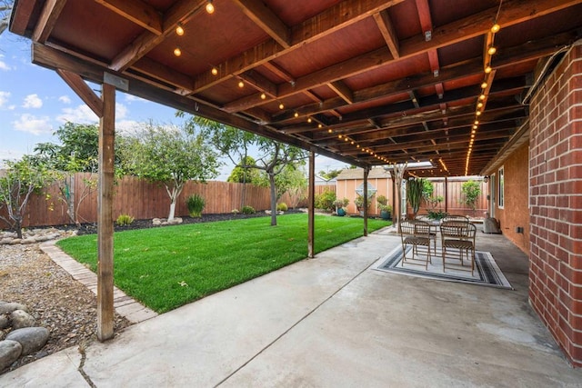 view of patio featuring outdoor dining space and a fenced backyard