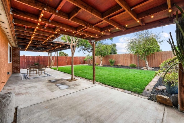 view of patio with outdoor dining area and a fenced backyard