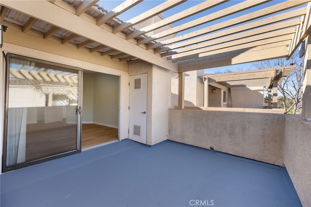 view of patio with a balcony, visible vents, and a pergola