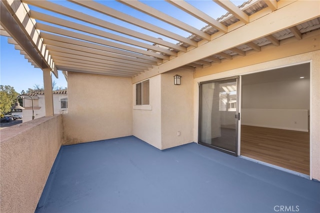 view of patio featuring a balcony and a pergola