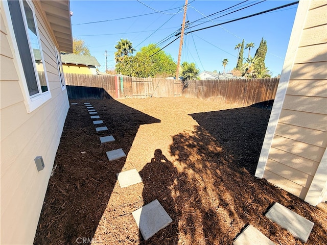 view of yard with a fenced backyard