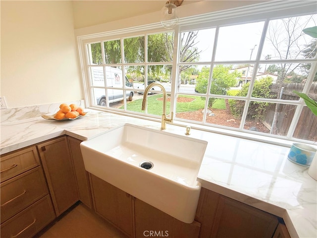 bathroom with plenty of natural light and a sink