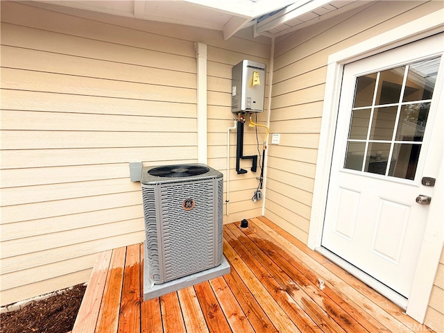 exterior details featuring central AC unit and water heater