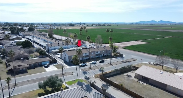 birds eye view of property with a rural view