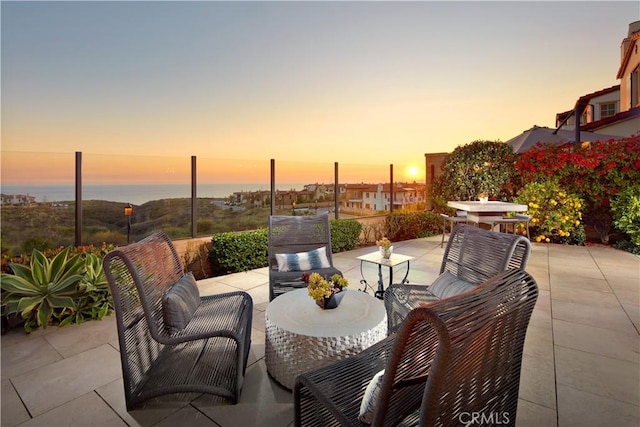 view of patio terrace at dusk