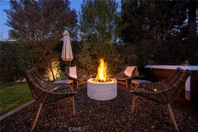 view of patio / terrace with an outdoor fire pit