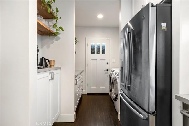 kitchen featuring white cabinetry, light countertops, dark wood-style flooring, and freestanding refrigerator