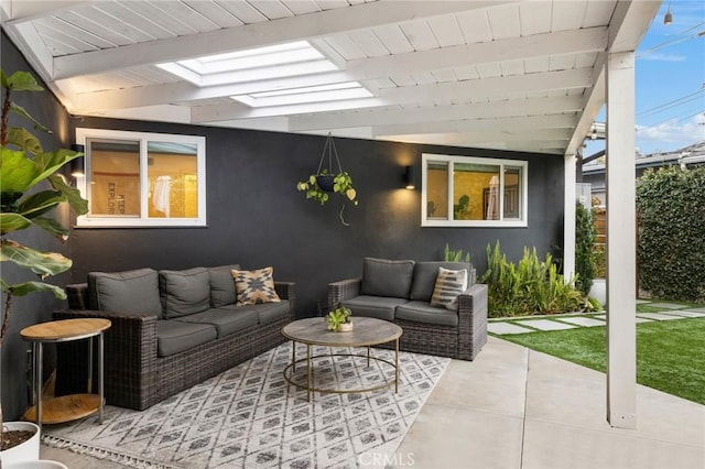 tiled living area featuring a wall of windows and lofted ceiling with skylight