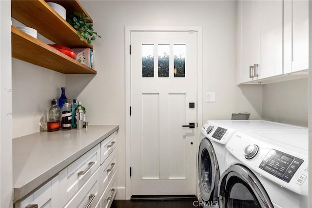 laundry area featuring cabinet space and washer and dryer