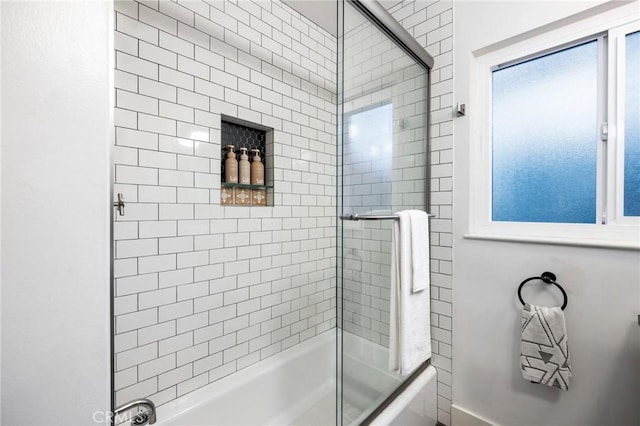 full bathroom with shower / bath combination with glass door