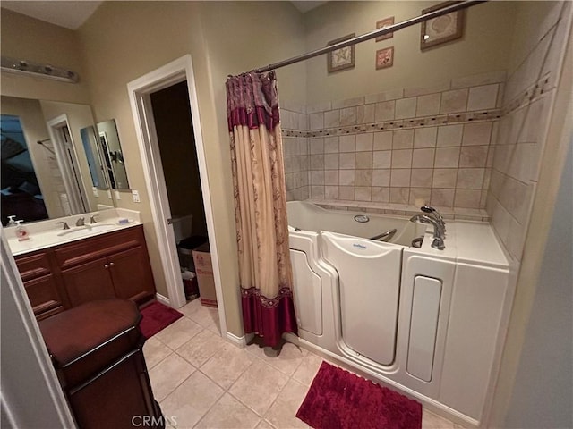 bathroom featuring tile patterned flooring, curtained shower, a washtub, and vanity