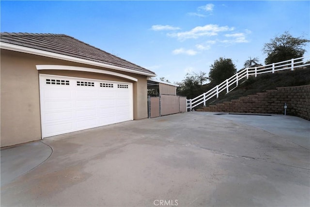 garage featuring fence