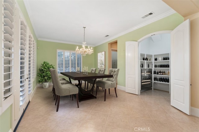 dining area with light tile patterned flooring, visible vents, and ornamental molding