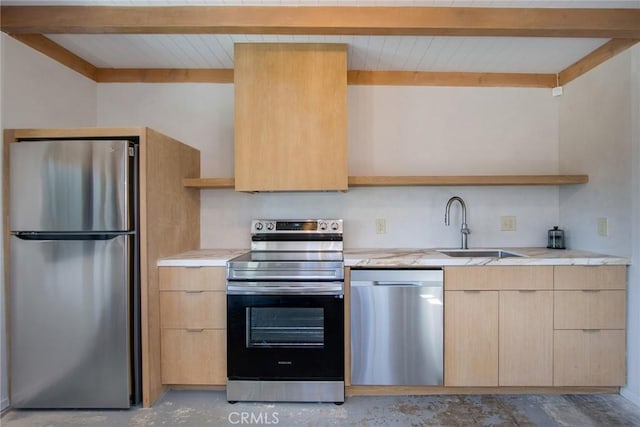 kitchen featuring beam ceiling, a sink, light brown cabinetry, light countertops, and stainless steel appliances