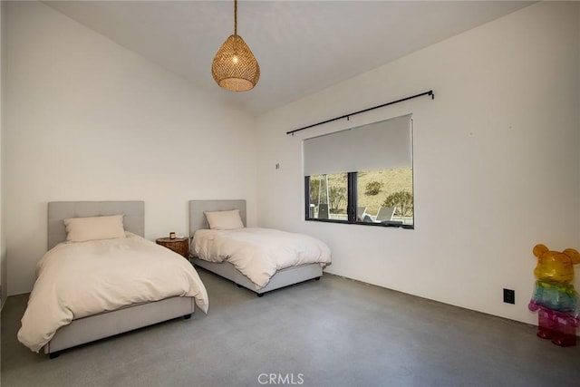 bedroom with finished concrete flooring