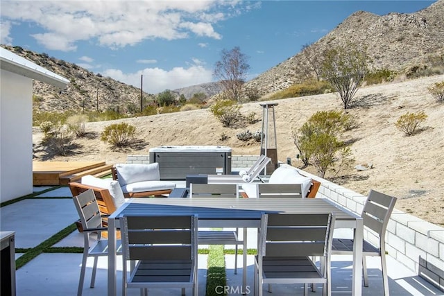 view of patio / terrace featuring a mountain view