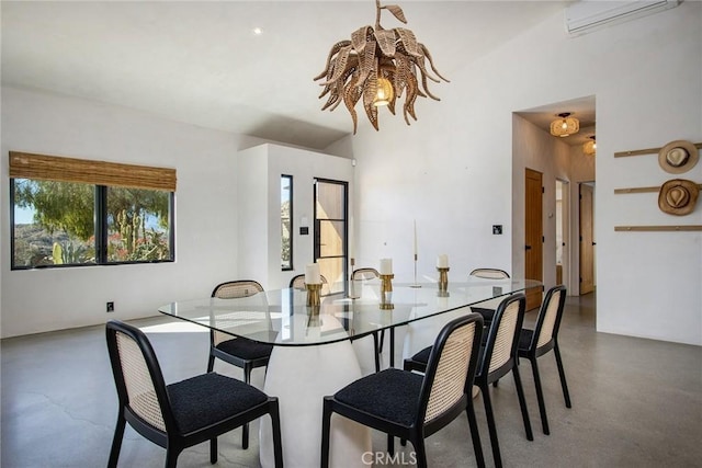 dining space featuring finished concrete flooring and a wall mounted AC