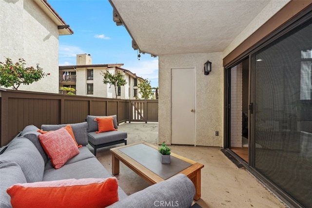 view of patio with outdoor lounge area and fence