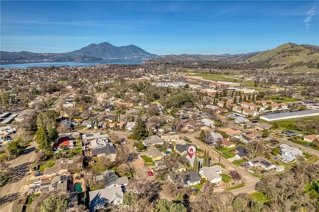 aerial view with a residential view and a water and mountain view