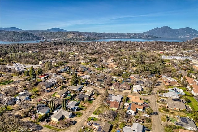 birds eye view of property featuring a residential view and a water and mountain view