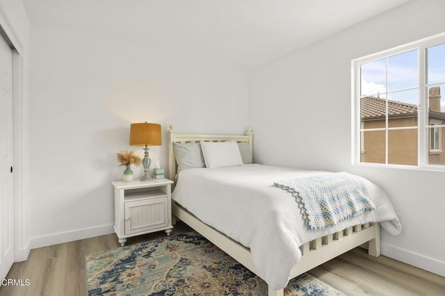 3012 Dunkirk Dr, Oxnard, CA 93035 - bedroom with a closet, baseboards, and wood finished floors