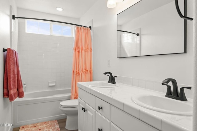 3012 Dunkirk Dr, Oxnard, CA 93035 - bathroom featuring a sink, shower / bath combo with shower curtain, toilet, and double vanity