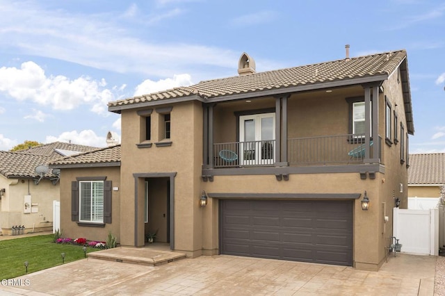 3012 Dunkirk Dr, Oxnard, CA 93035 - view of front of house featuring a balcony, fence, stucco siding, french doors, and a tile roof