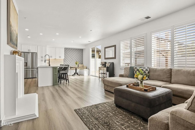 3012 Dunkirk Dr, Oxnard, CA 93035 - living area featuring recessed lighting, visible vents, and light wood-style flooring