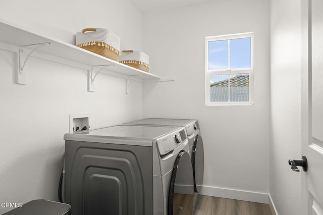 3012 Dunkirk Dr, Oxnard, CA 93035 - washroom with washer and dryer, laundry area, wood finished floors, and baseboards