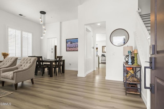 3012 Dunkirk Dr, Oxnard, CA 93035 - dining space with light wood-type flooring, visible vents, baseboards, and stairs