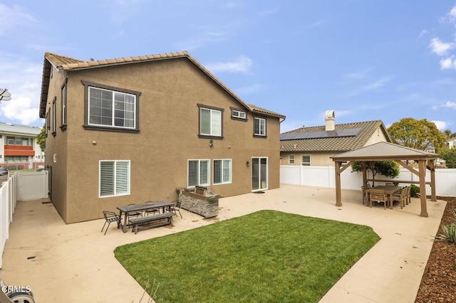 3012 Dunkirk Dr, Oxnard, CA 93035 - rear view of property featuring a patio, a fenced backyard, stucco siding, a gazebo, and a lawn