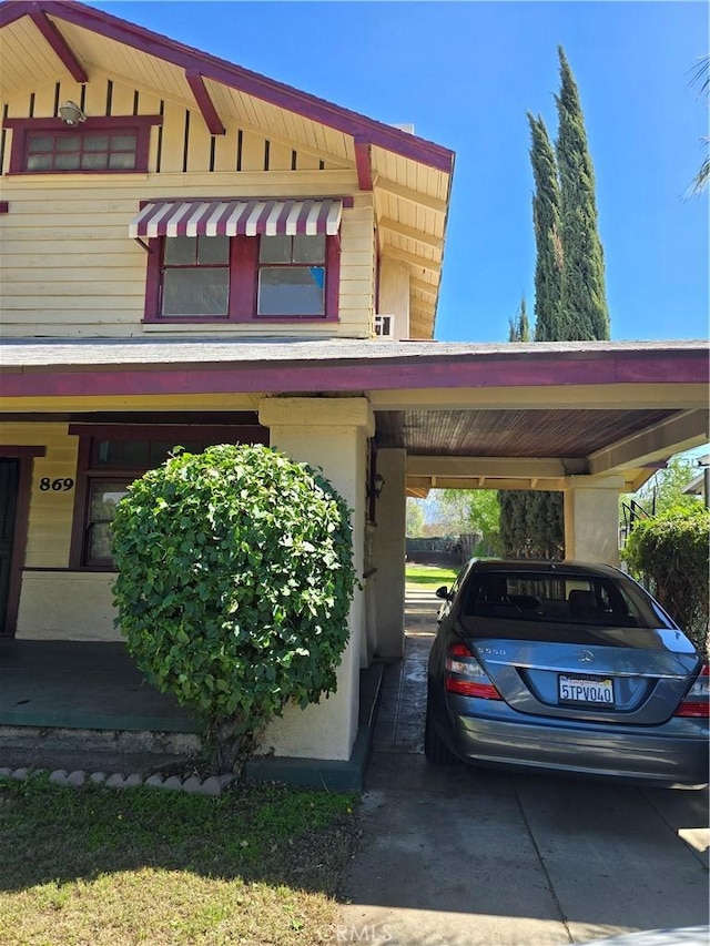 exterior space featuring a carport