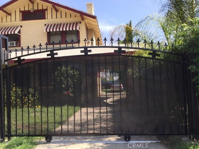 view of gate with fence